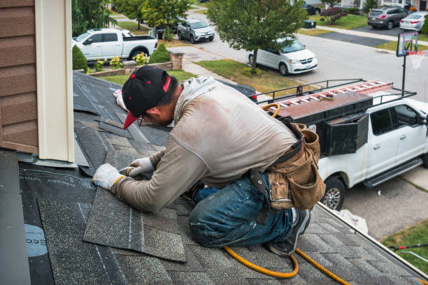 Professional Roofing technician working in South Hamilton, MA